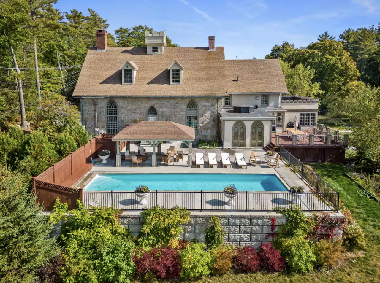 Castle stay with outdoor pool and lounge chairs surrounding it